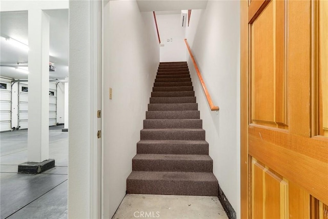 stairs with concrete floors