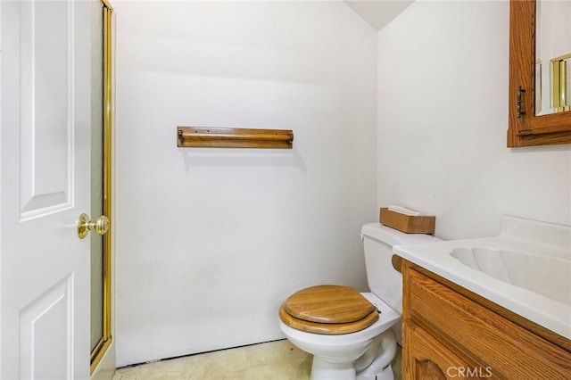 bathroom featuring toilet and vanity