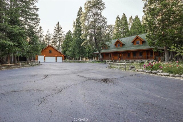 exterior space with an outdoor structure and a garage