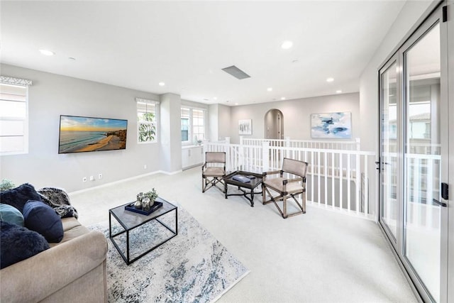 living room featuring light carpet