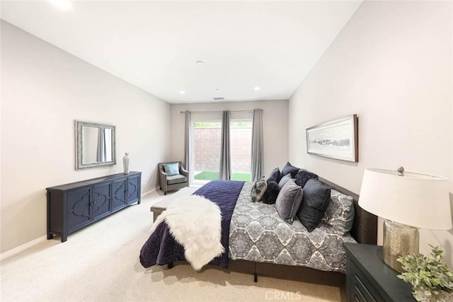 carpeted bedroom featuring lofted ceiling