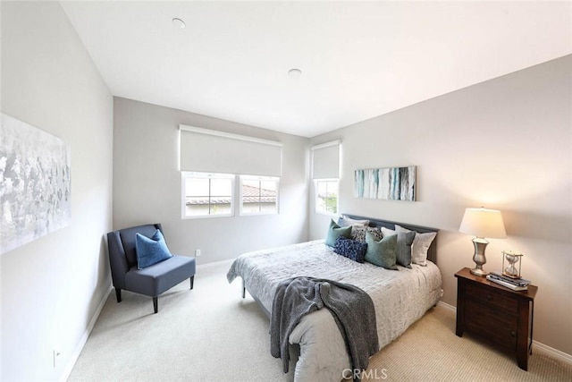 bedroom with light colored carpet