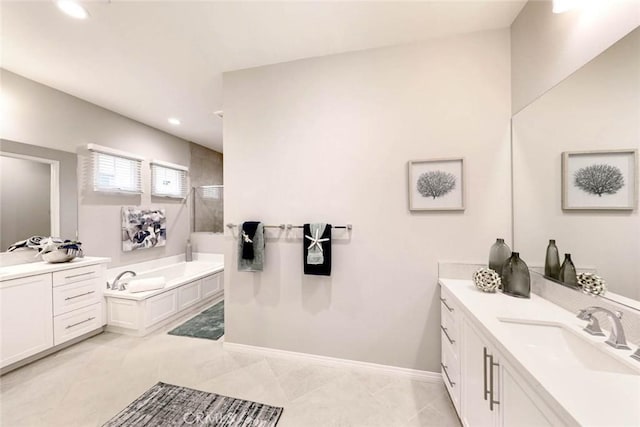 bathroom featuring a washtub, vanity, and tile patterned floors