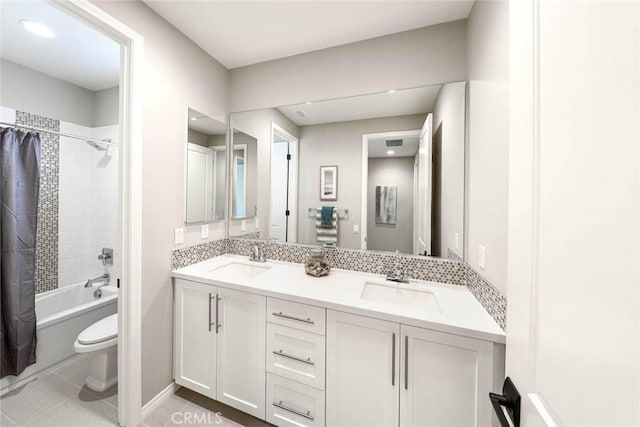 full bathroom with shower / bath combo, vanity, backsplash, tile patterned floors, and toilet