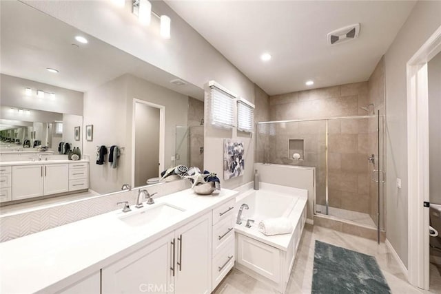 full bathroom with shower with separate bathtub, vanity, toilet, and tile patterned floors