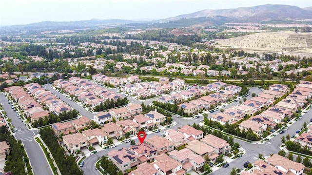 birds eye view of property with a mountain view