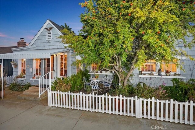 1407 N Bay Front E, Newport Beach, CA 92662 - view of front of property featuring a fenced front yard and a patio