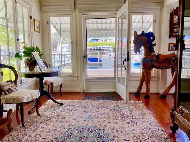 1407 N Bay Front E, Newport Beach, CA 92662 - sunroom / solarium with baseboards and wood finished floors