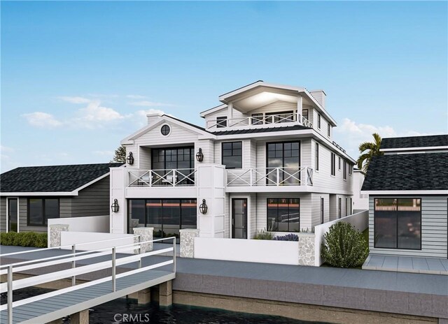 1407 N Bay Front E, Newport Beach, CA 92662 - rear view of property with a balcony, a fenced front yard, a chimney, and concrete driveway