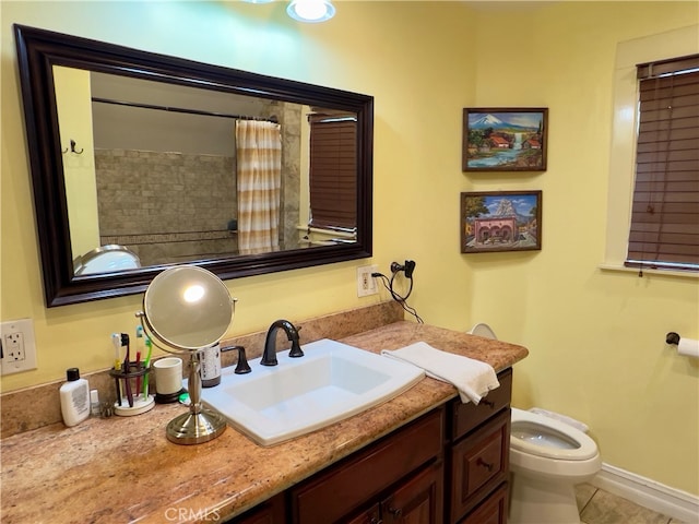 bathroom featuring tile patterned flooring, vanity, toilet, and a shower with shower curtain