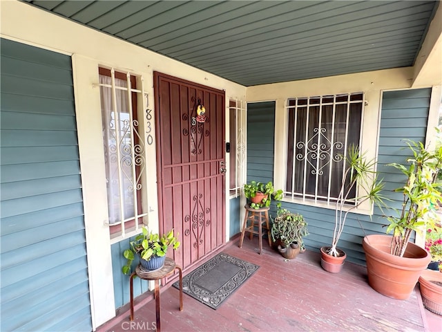 doorway to property with a porch