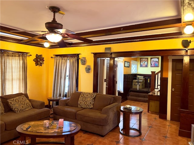 tiled living room featuring ceiling fan and a healthy amount of sunlight