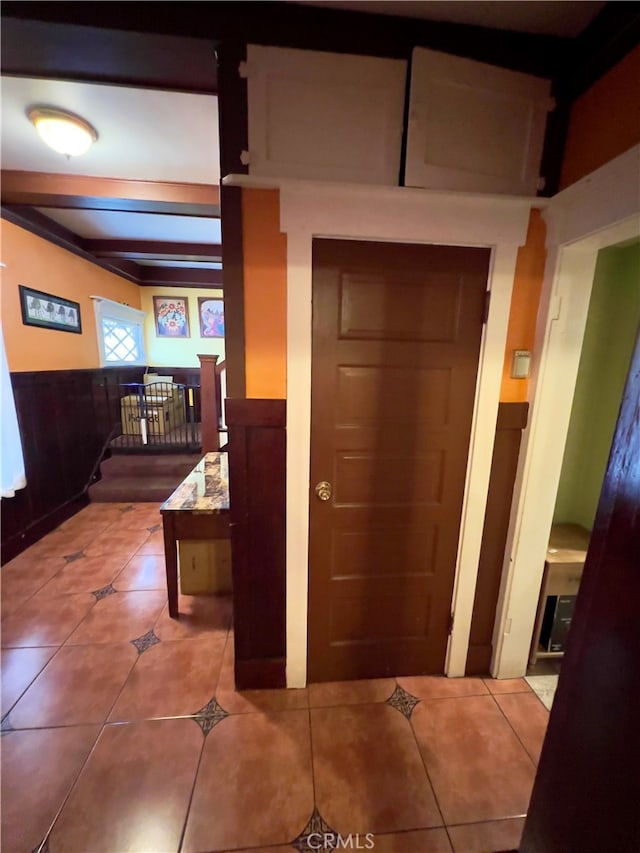 corridor with light tile patterned flooring