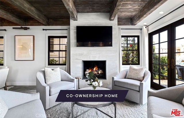 living room with beam ceiling, french doors, wood ceiling, and a fireplace