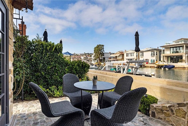 view of patio / terrace with a water view