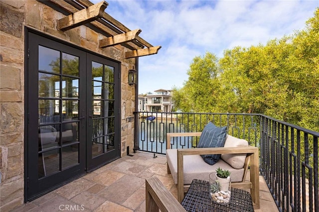 balcony featuring french doors