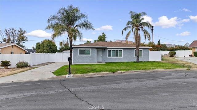 ranch-style home featuring a front yard