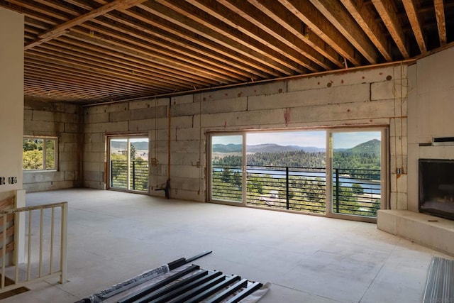 misc room with a mountain view and plenty of natural light