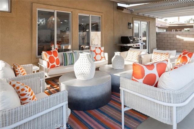 view of patio featuring a pergola, outdoor lounge area, and a grill