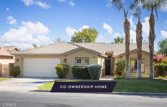 single story home featuring a front yard and a garage