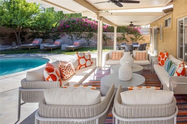 view of patio featuring ceiling fan, a fenced in pool, and an outdoor living space