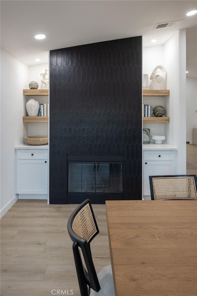 dining space with light hardwood / wood-style floors