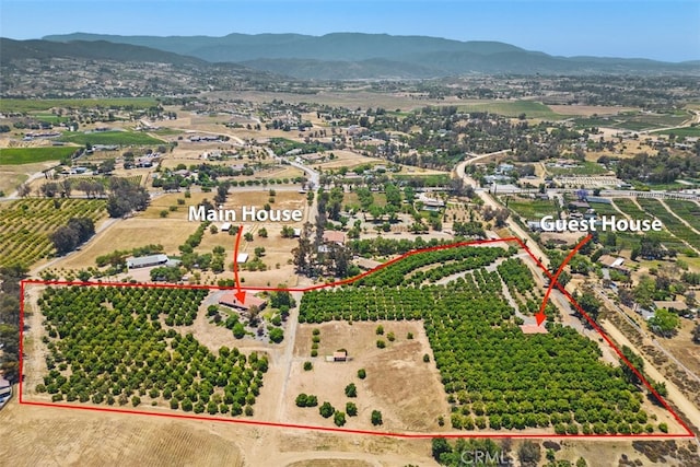 bird's eye view with a mountain view and a rural view