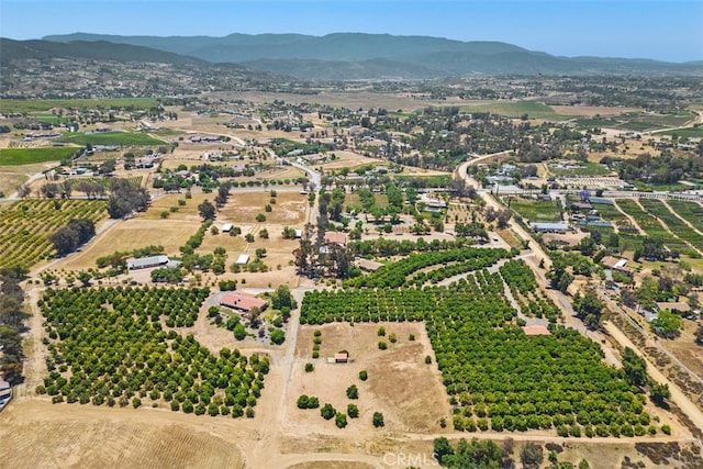 aerial view with a mountain view and a rural view