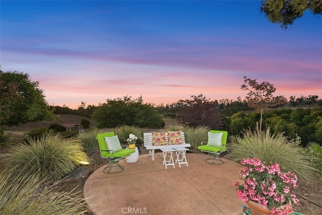 view of patio terrace at dusk