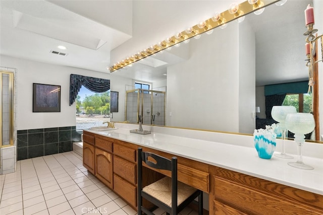 bathroom featuring vanity, an enclosed shower, and tile patterned flooring