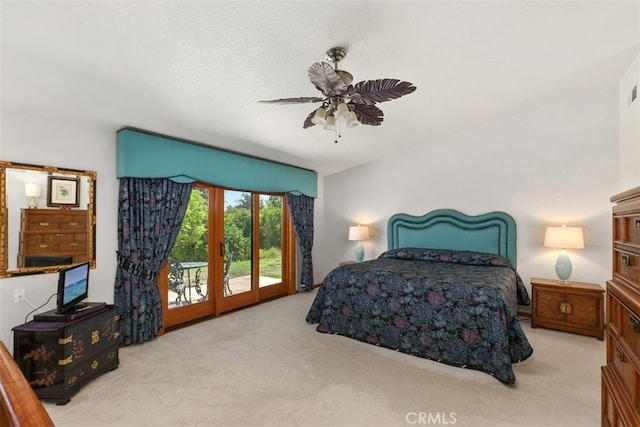 carpeted bedroom with ceiling fan and access to outside