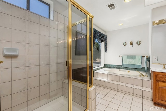 bathroom featuring vanity, shower with separate bathtub, and tile patterned floors