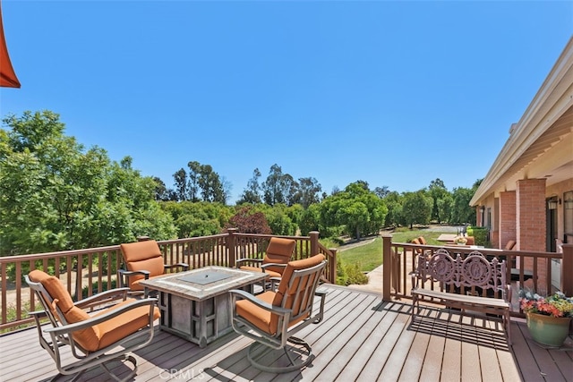 deck featuring a fire pit