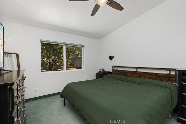 bedroom featuring ceiling fan, vaulted ceiling, and carpet floors