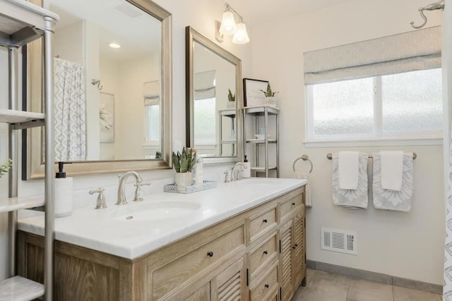 bathroom featuring vanity and tile patterned flooring