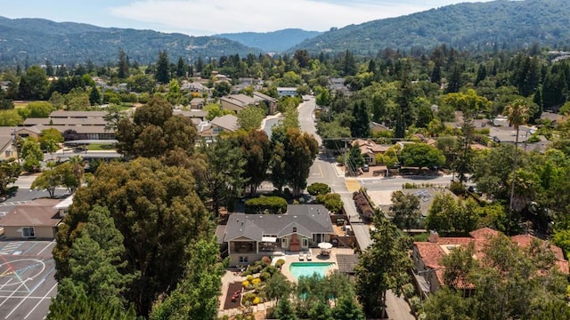 birds eye view of property with a mountain view