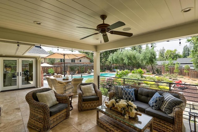 view of patio / terrace featuring a fenced in pool, french doors, an outdoor hangout area, and ceiling fan