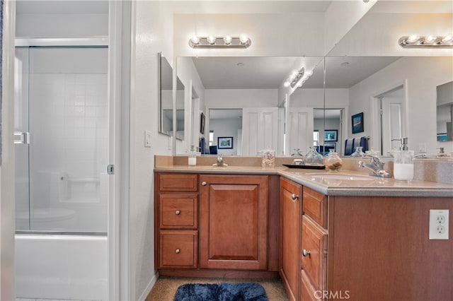 bathroom with vanity and enclosed tub / shower combo