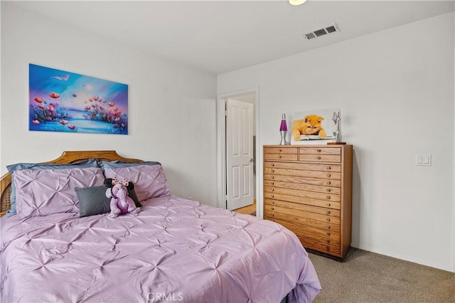 bedroom featuring light colored carpet, baseboards, and visible vents