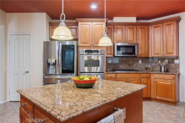 kitchen with light tile patterned flooring, tasteful backsplash, light stone countertops, and stainless steel appliances
