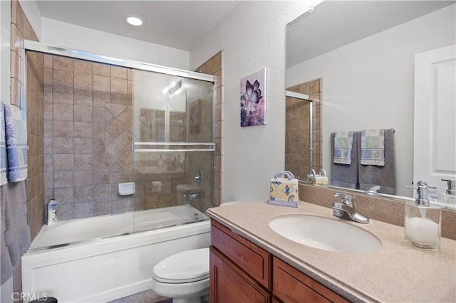 bathroom with shower / bath combination with glass door, toilet, vanity, and recessed lighting