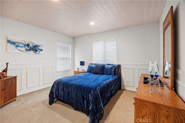 bedroom featuring light carpet and wooden ceiling