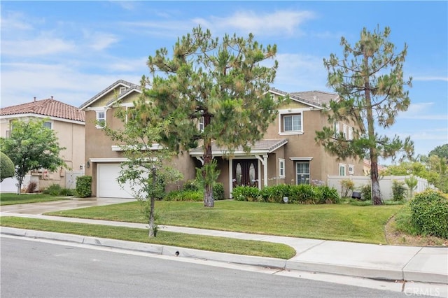 view of front facade with stucco siding, a front lawn, a garage, and concrete driveway