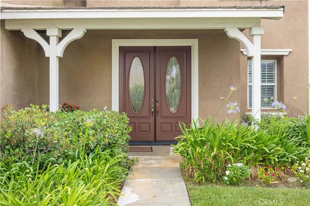 doorway to property featuring a porch