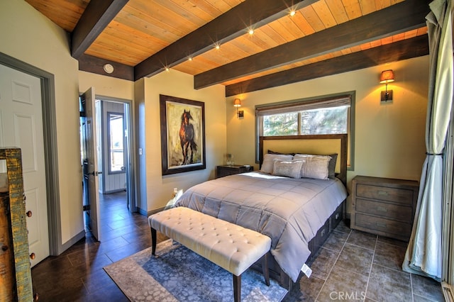 bedroom with dark tile patterned flooring, beam ceiling, and wooden ceiling