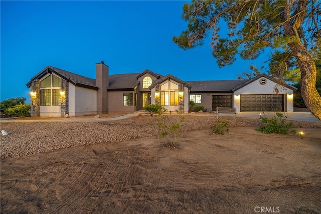 ranch-style home featuring a garage