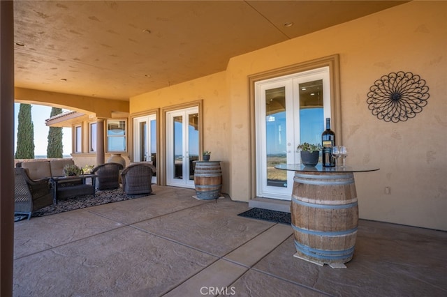 view of patio featuring french doors and an outdoor living space