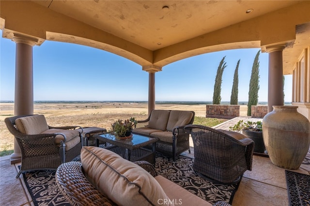 view of patio / terrace featuring outdoor lounge area and a rural view