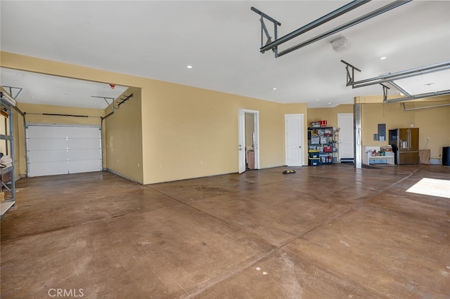 garage featuring high end refrigerator and electric panel