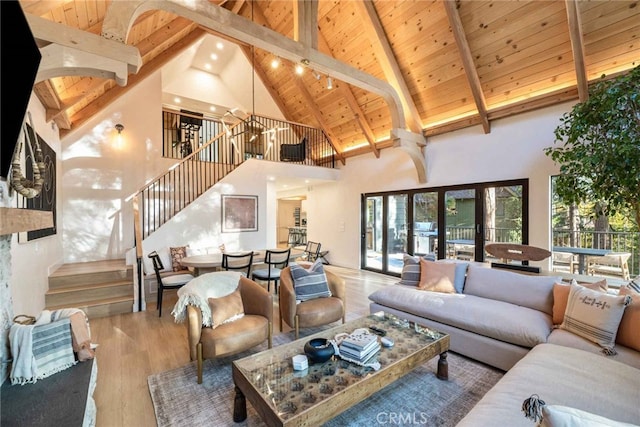 living room featuring a chandelier, beam ceiling, high vaulted ceiling, hardwood / wood-style floors, and wooden ceiling